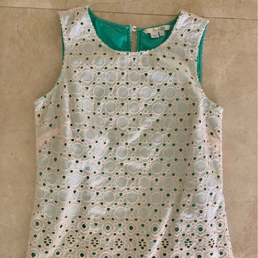 Women’s sleeveless cream eyelet lace top with teal under layer